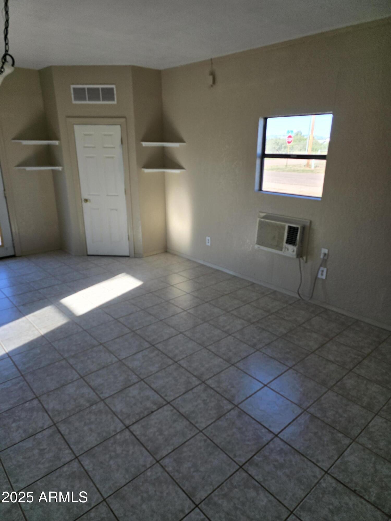 240 East Oak Street Huachuca City, AZ 85616 - Photo 40 of 43 an empty room with windows