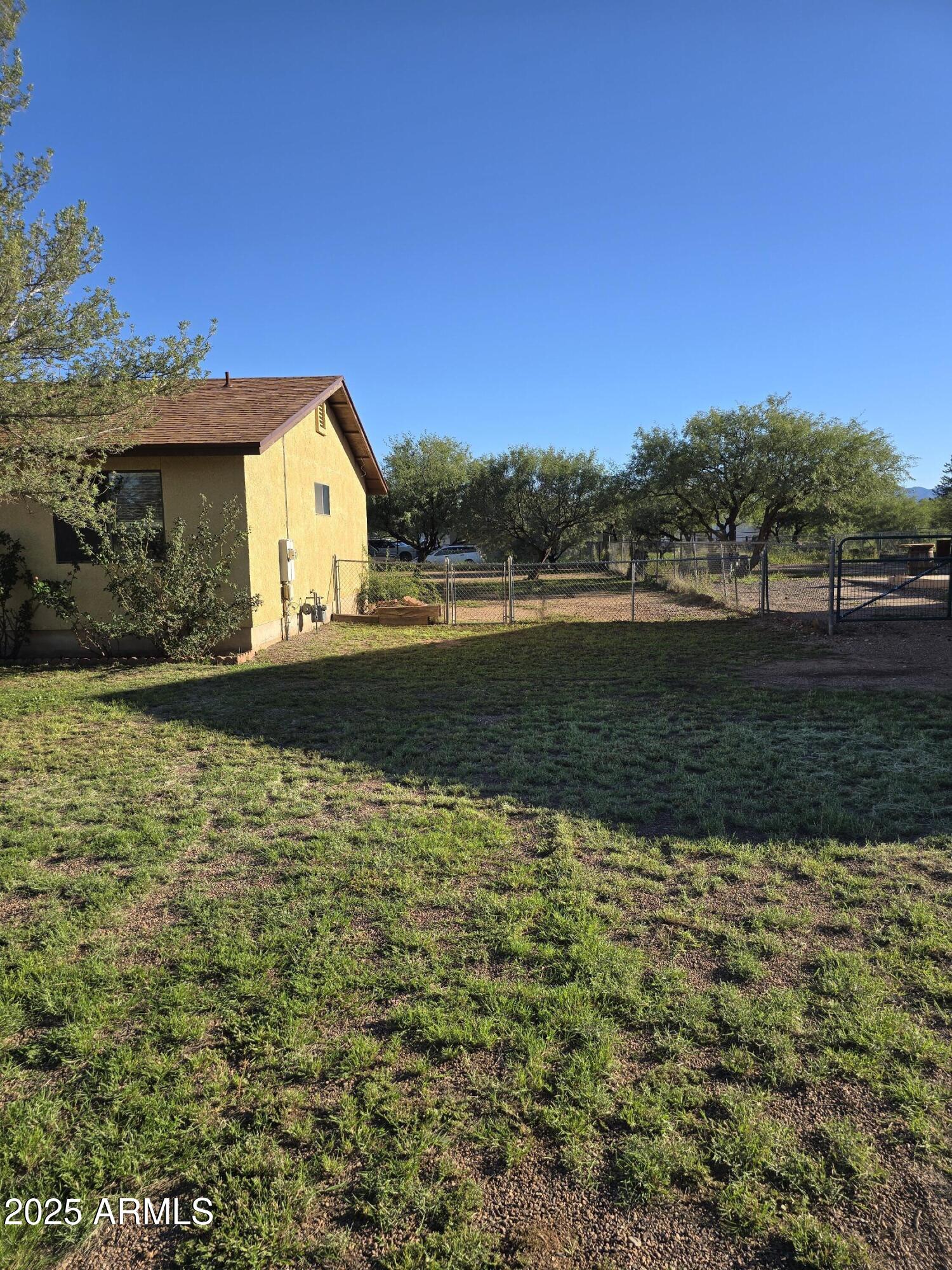 240 East Oak Street Huachuca City, AZ 85616 - Photo 5 of 43 a view of a house with a yard