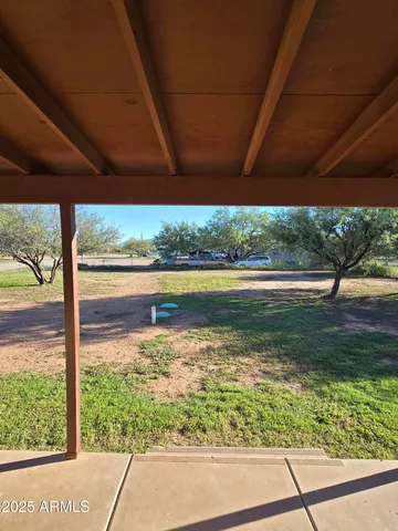 a view of a water fountain and a big yard