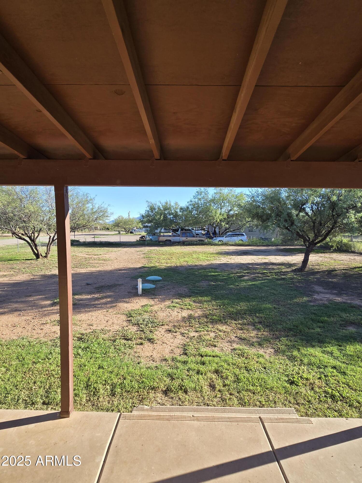 240 East Oak Street Huachuca City, AZ 85616 - Photo 9 of 43 a view of a water fountain and a big yard