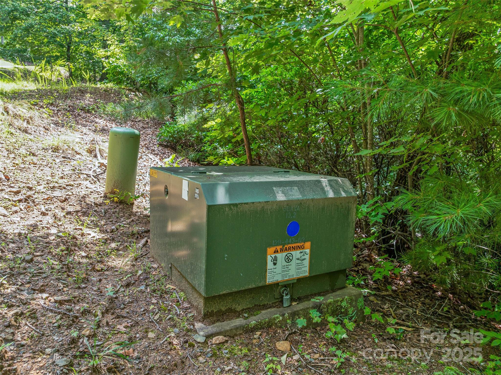 72 Smokey Ridge Trail, Unit 196 Arden, NC 28704 - Photo 28 of 34 a sign that is sitting on a rock