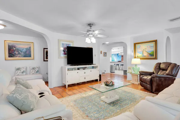 a large kitchen with kitchen island granite countertop a large counter top stainless steel appliances and cabinets