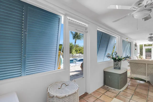 a view of a house with swimming pool and sitting area