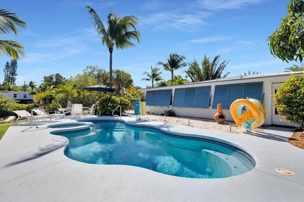 a view of a patio with swimming pool