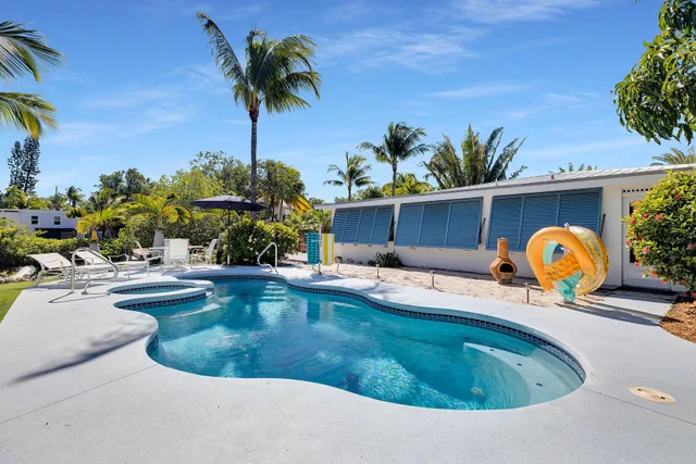 a view of a patio with swimming pool
