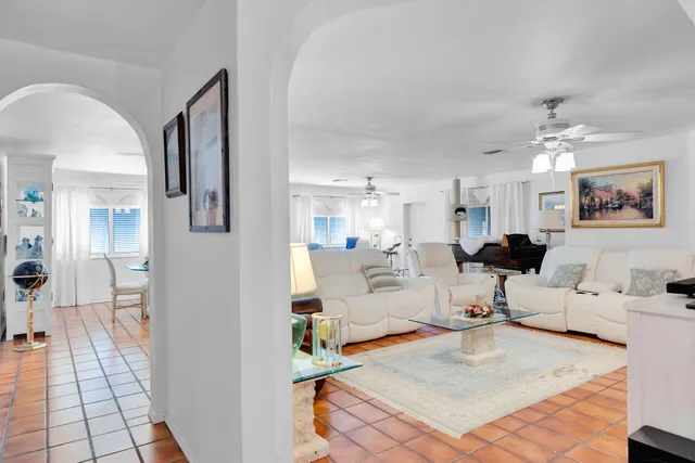 a living room with furniture fireplace and a flat screen tv