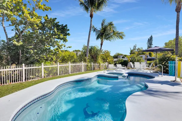 a view of a patio with swimming pool