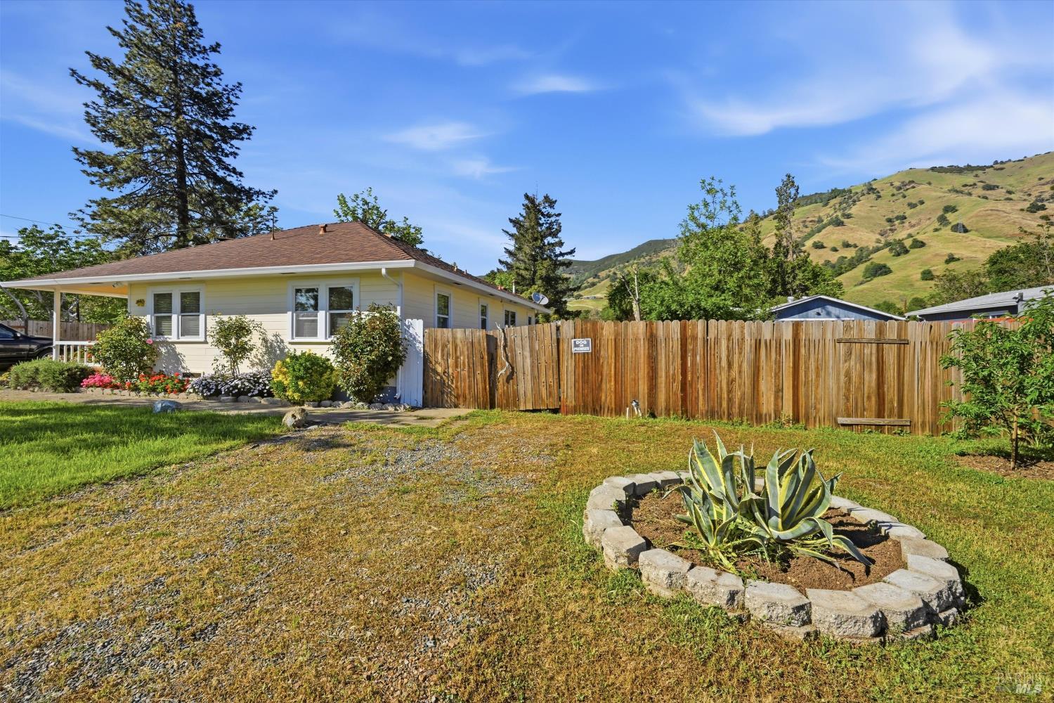 3440 Beach Street Nice, CA 95464 - Photo 21 of 27 a view of a house with backyard and sitting area