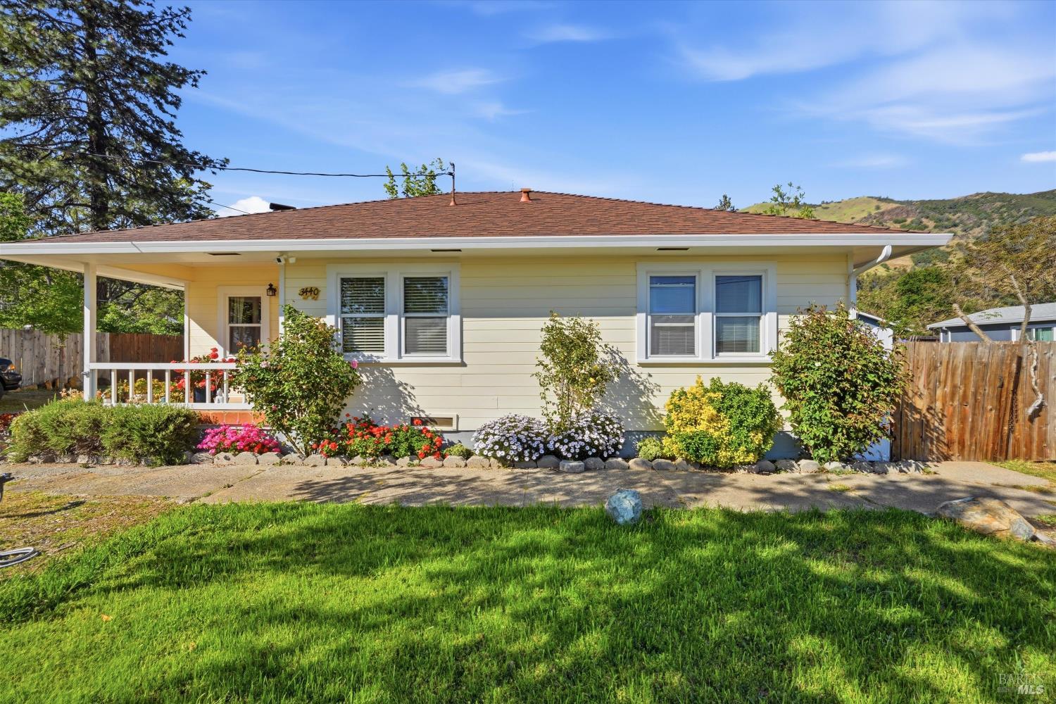 3440 Beach Street Nice, CA 95464 - Photo 22 of 27 a front view of a house with a yard