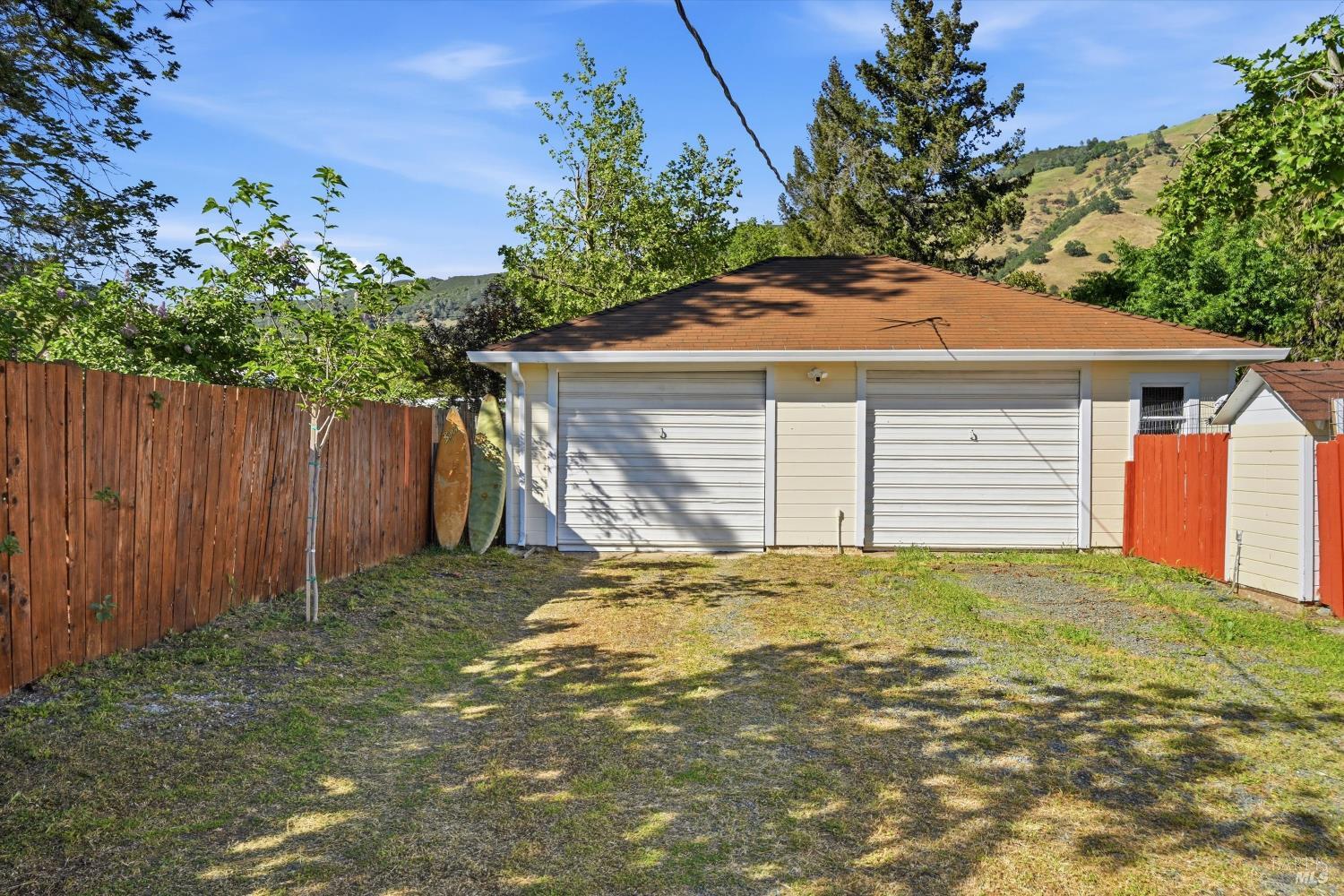3440 Beach Street Nice, CA 95464 - Photo 23 of 27 a front view of a house with a garden