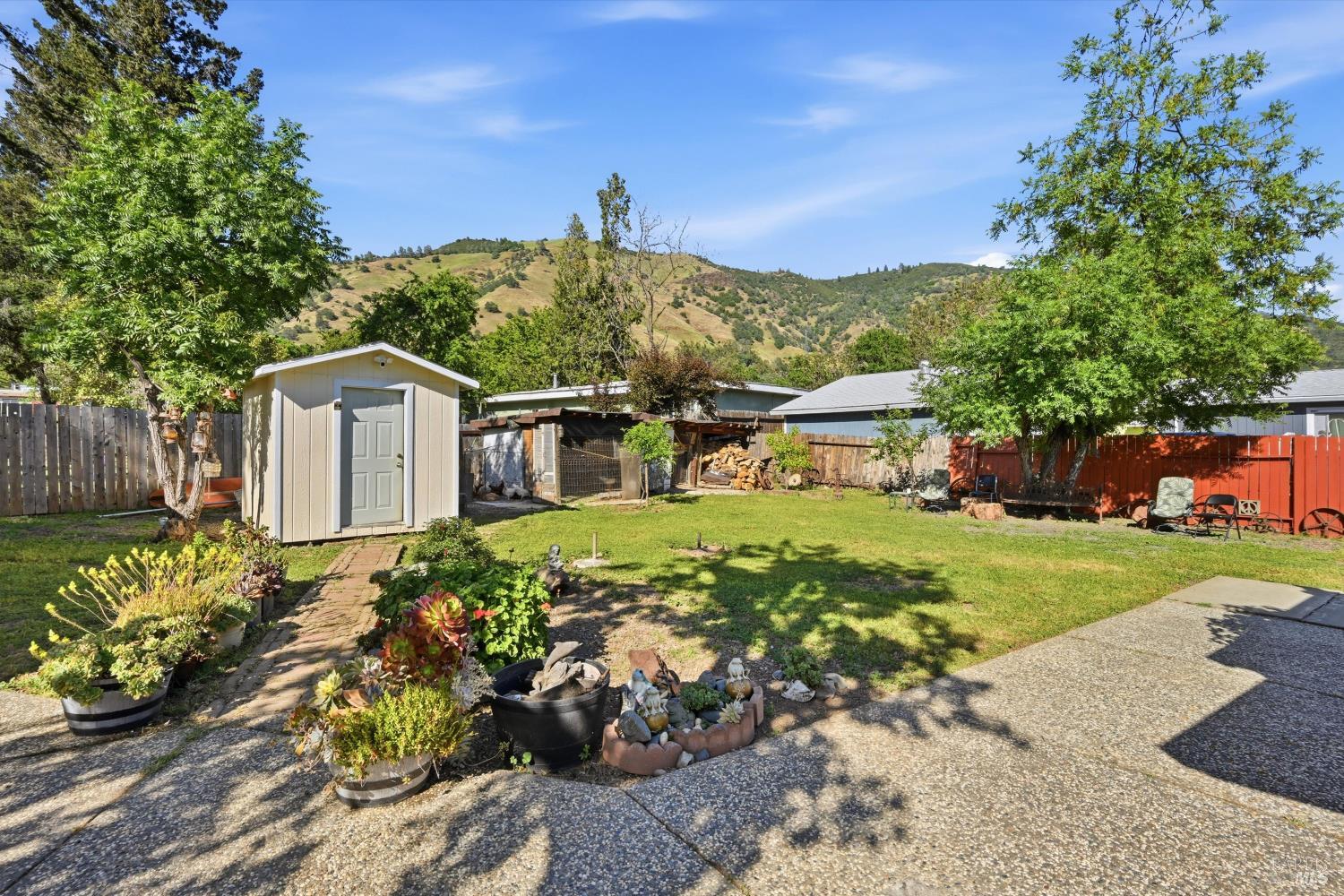 3440 Beach Street Nice, CA 95464 - Photo 24 of 27 a front view of a house with a yard