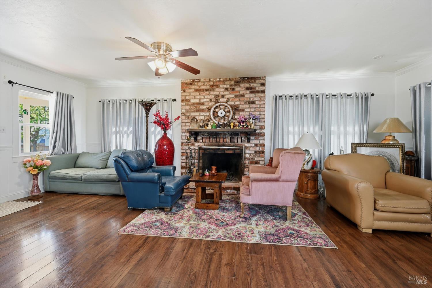 3440 Beach Street Nice, CA 95464 - Photo 7 of 27 a living room with furniture and a fireplace