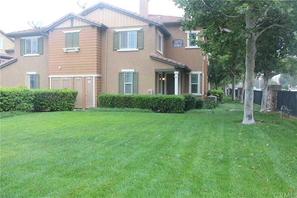 3870 Polk Street, Unit A Riverside, CA 92505 - Photo 1 of 1 a front view of a house with a yard and trees