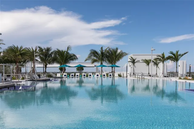 a view of swimming pool with outdoor seating