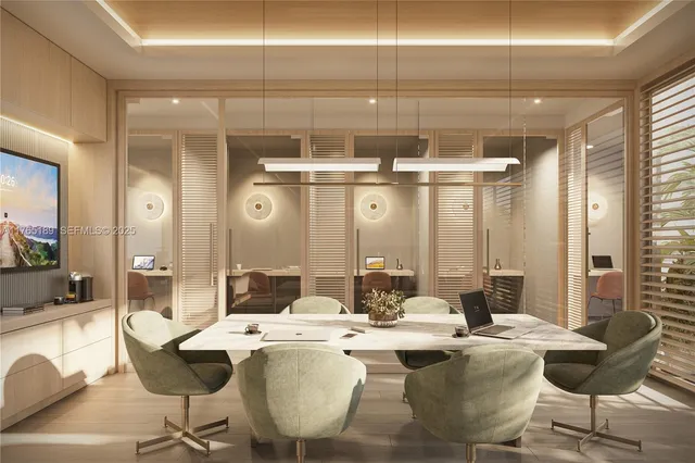 a dining room with couches a large mirror and a dining table with wooden floor