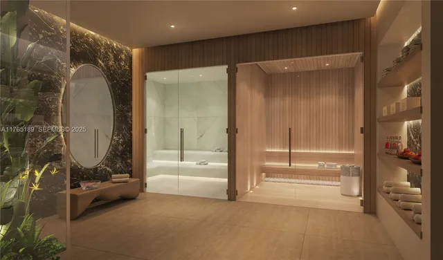 a bathroom with a tub a mirror and a shower