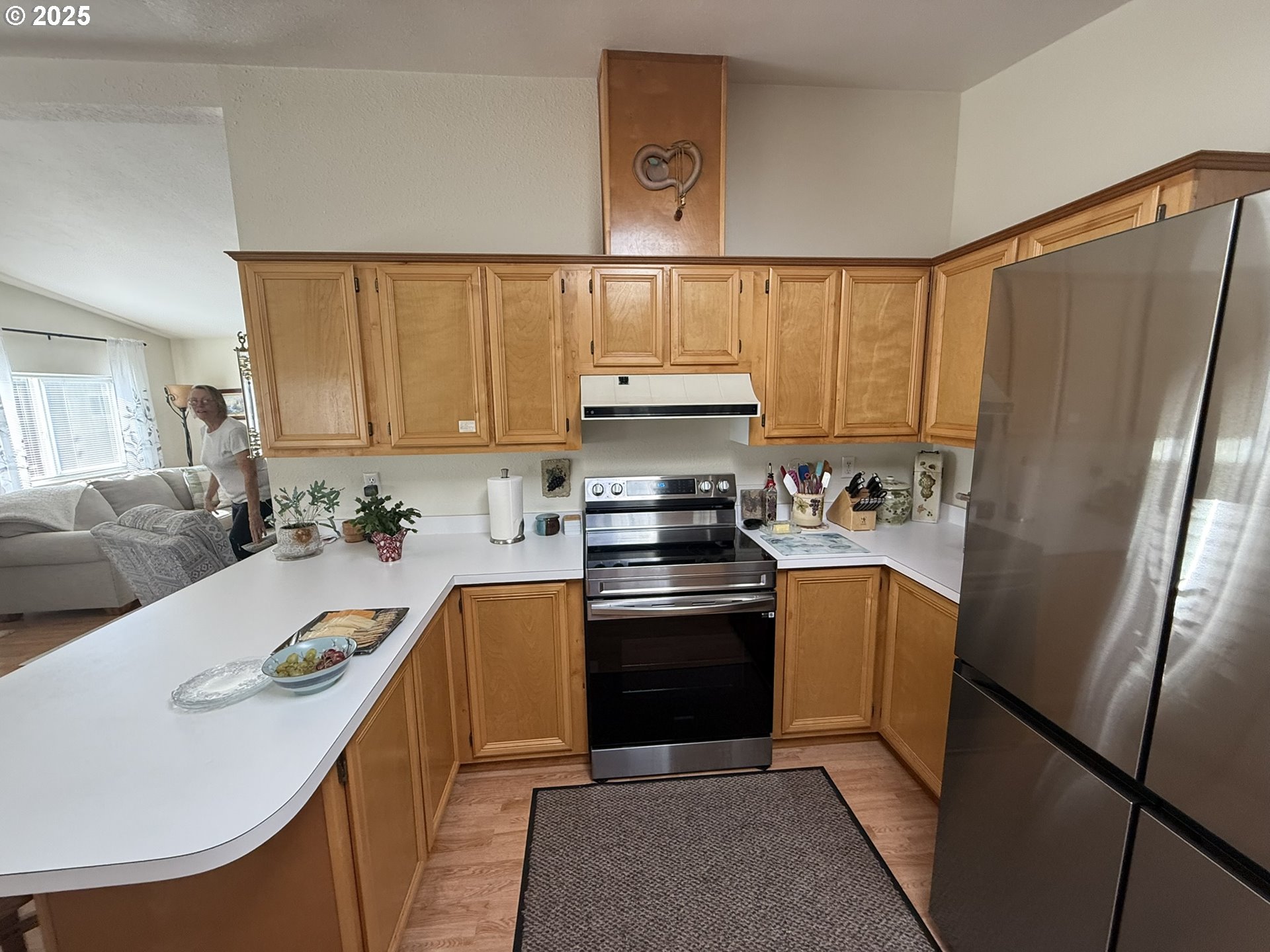 100 River Bend Road, Unit 17 Reedsport, OR 97467 - Photo 12 of 29 a kitchen with stainless steel appliances granite countertop a refrigerator sink and stove