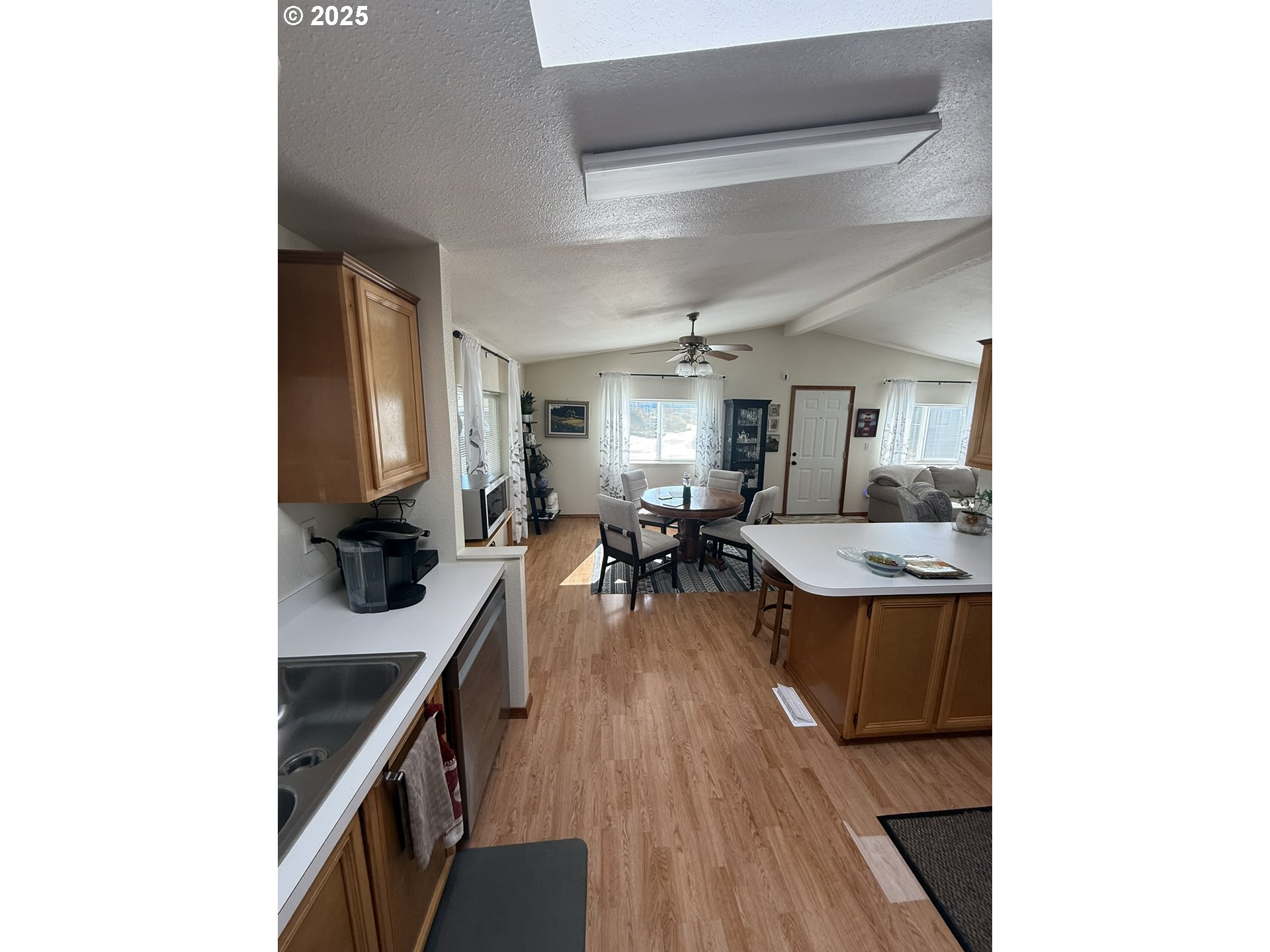 100 River Bend Road, Unit 17 Reedsport, OR 97467 - Photo 13 of 29 a kitchen with sink stove and cabinets