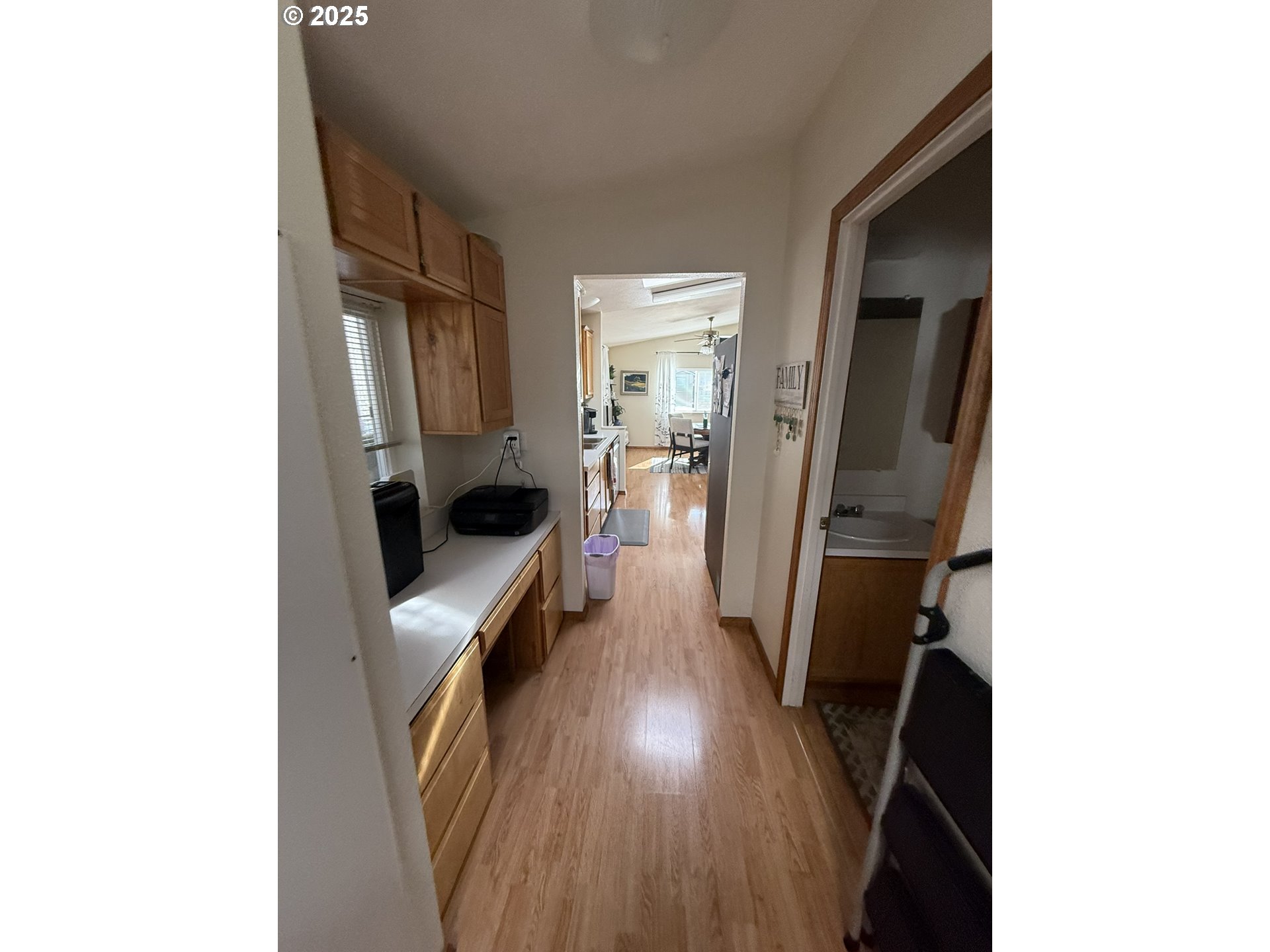 100 River Bend Road, Unit 17 Reedsport, OR 97467 - Photo 16 of 29 a hallway with a large mirror and cabinets