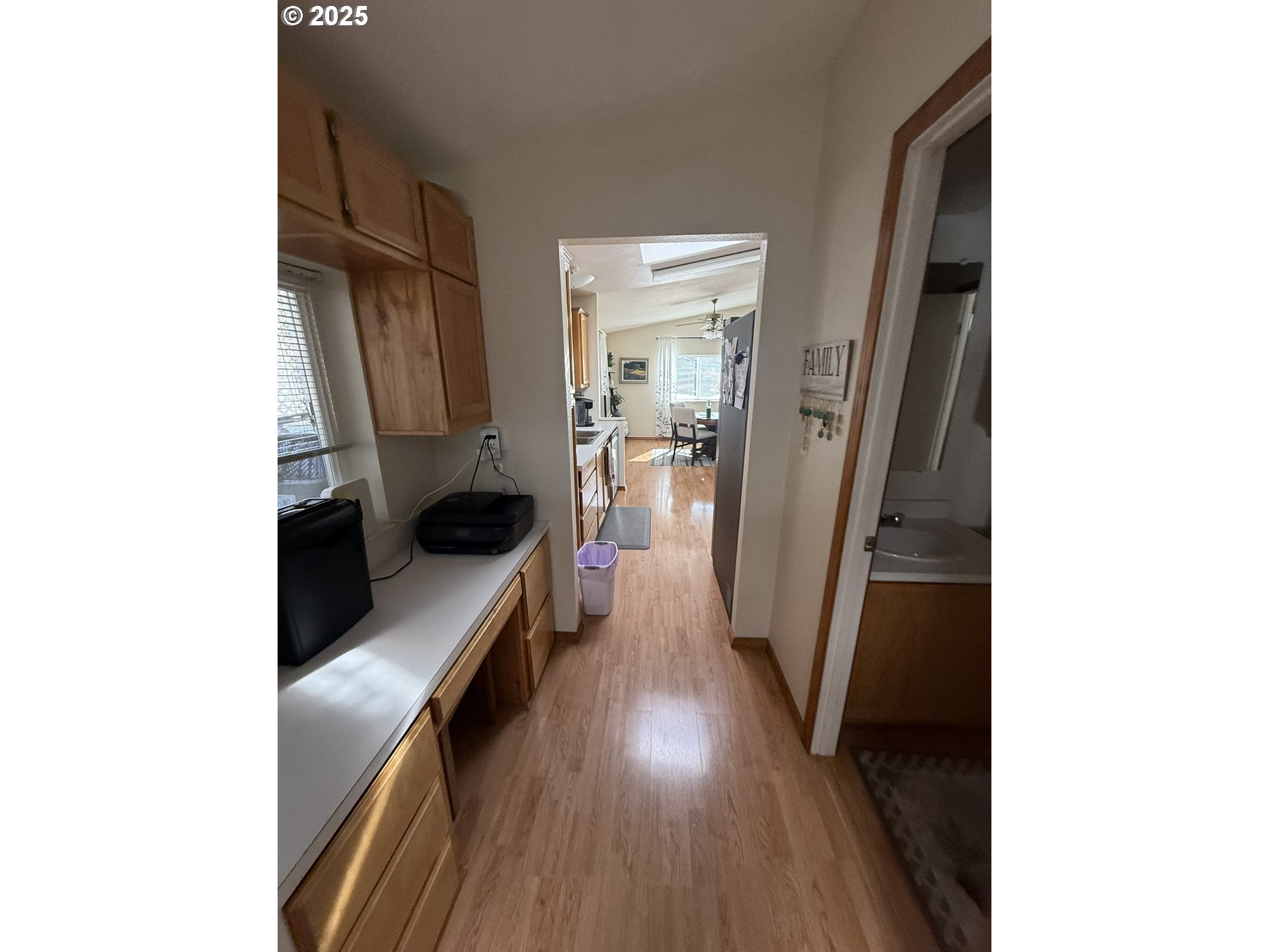 100 River Bend Road, Unit 17 Reedsport, OR 97467 - Photo 19 of 29 a hallway with a large cabinets and wooden floor
