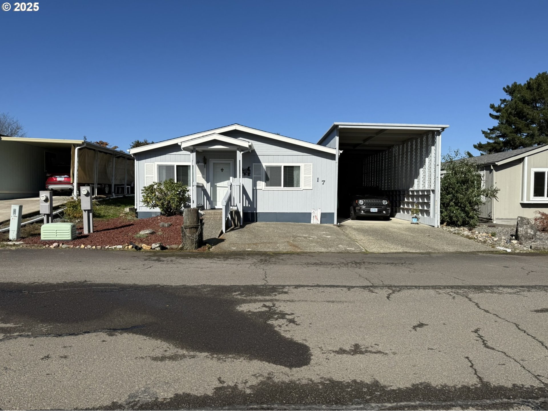 100 River Bend Road, Unit 17 Reedsport, OR 97467 - Photo 2 of 29 a front view of a house with a yard