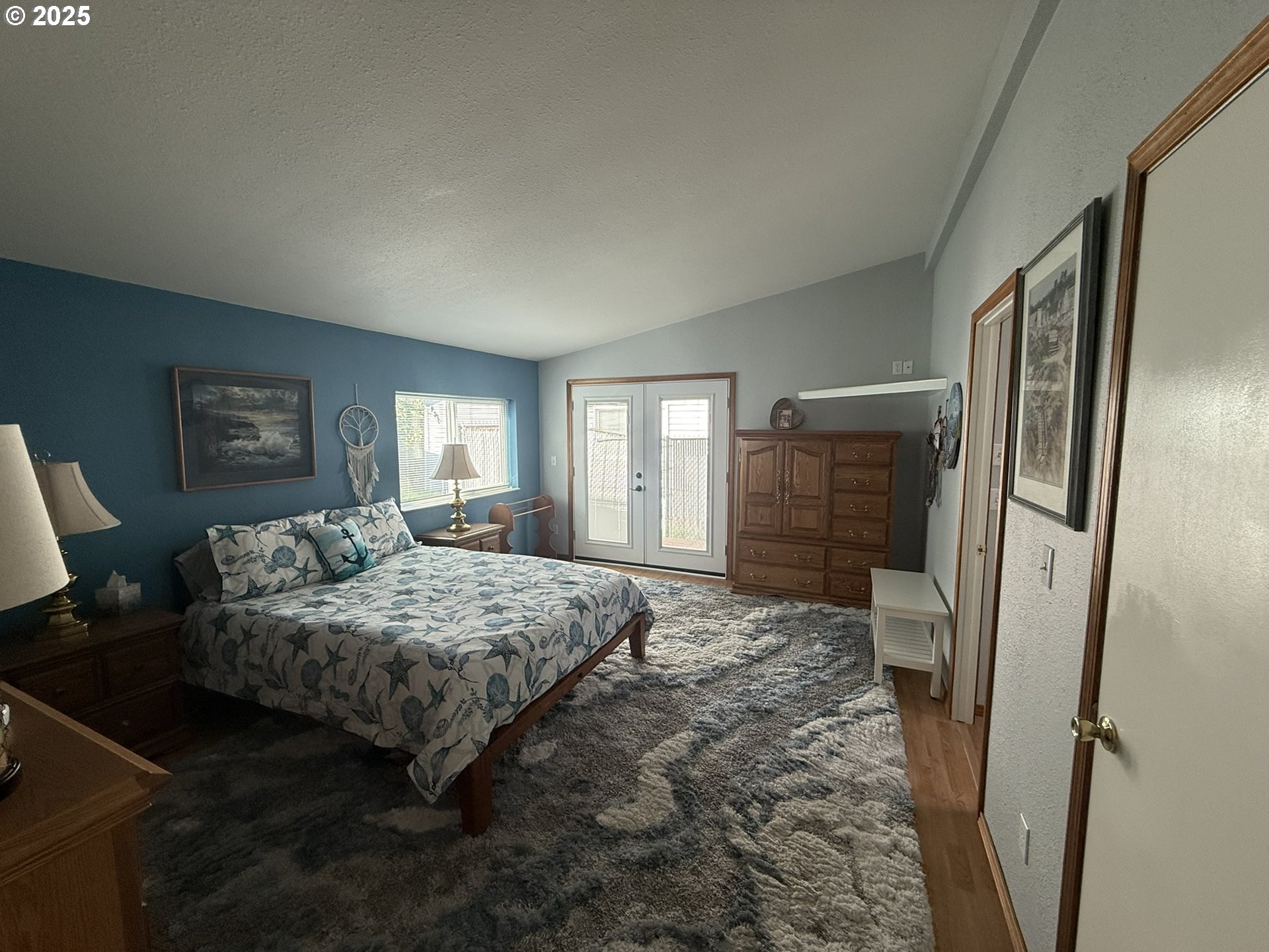 100 River Bend Road, Unit 17 Reedsport, OR 97467 - Photo 21 of 29 a bedroom with a bed and a dresser