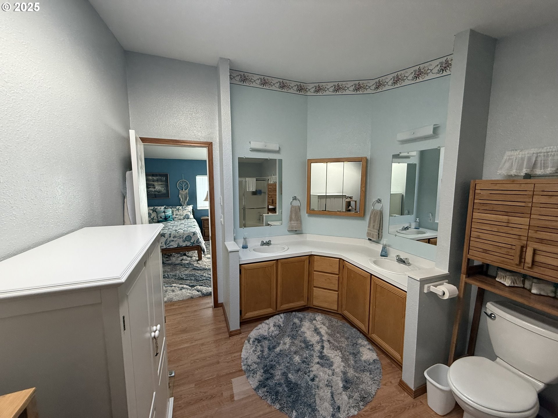 100 River Bend Road, Unit 17 Reedsport, OR 97467 - Photo 26 of 29 a bathroom with a sink a toilet and mirror