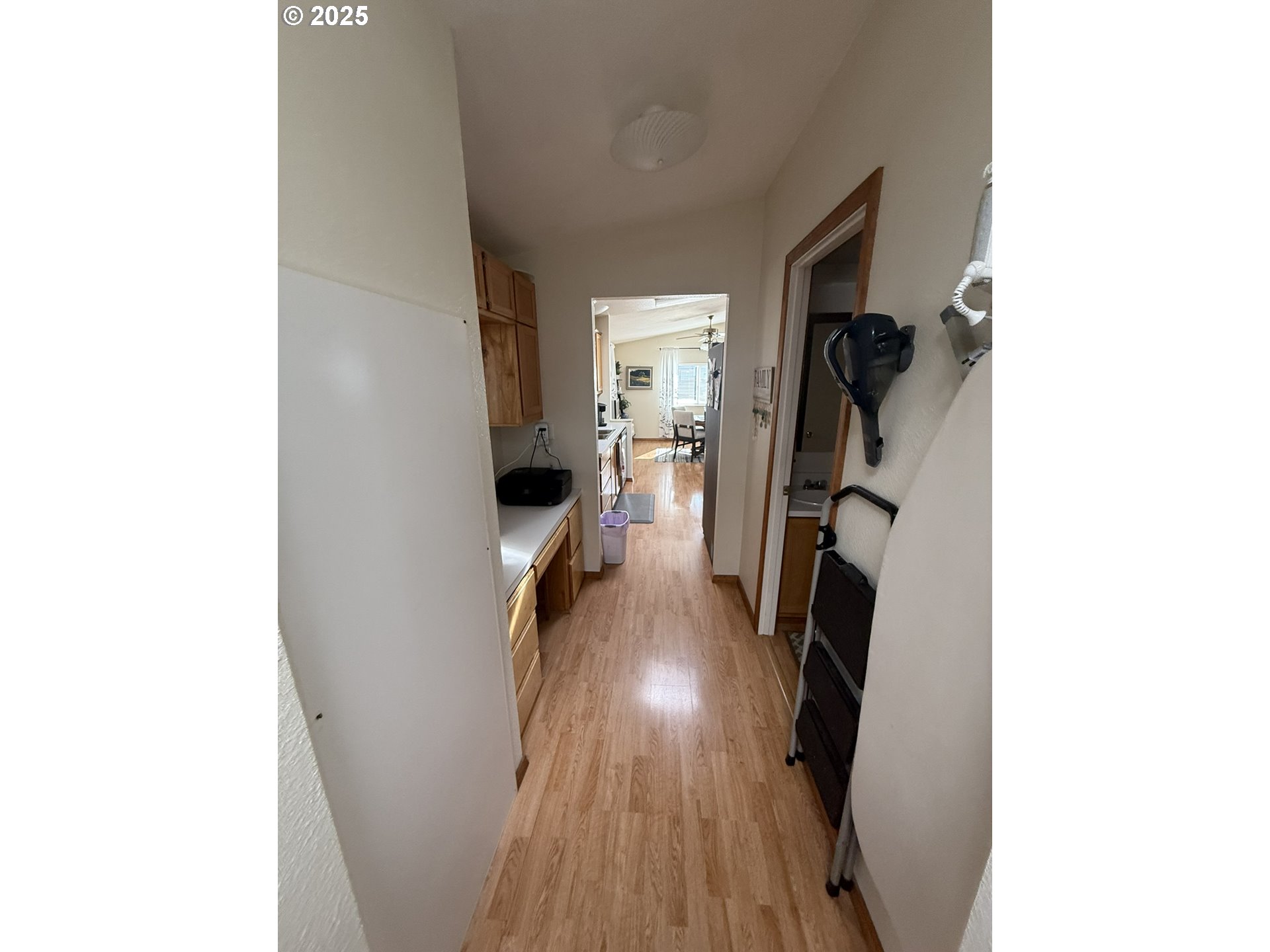 100 River Bend Road, Unit 17 Reedsport, OR 97467 - Photo 28 of 29 a view of a hallway with wooden floor and a hallway