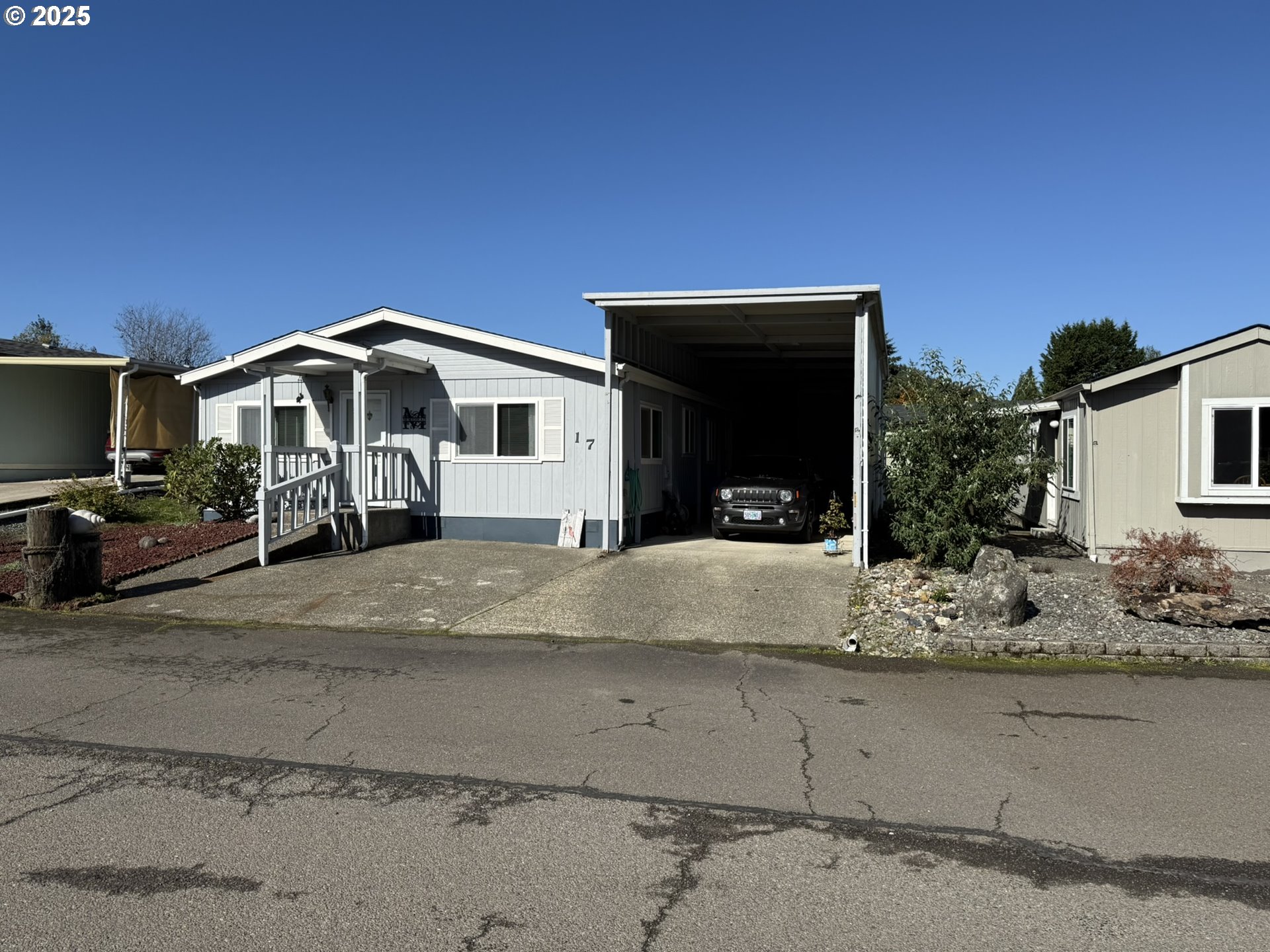 100 River Bend Road, Unit 17 Reedsport, OR 97467 - Photo 3 of 29 a front view of a house with a yard