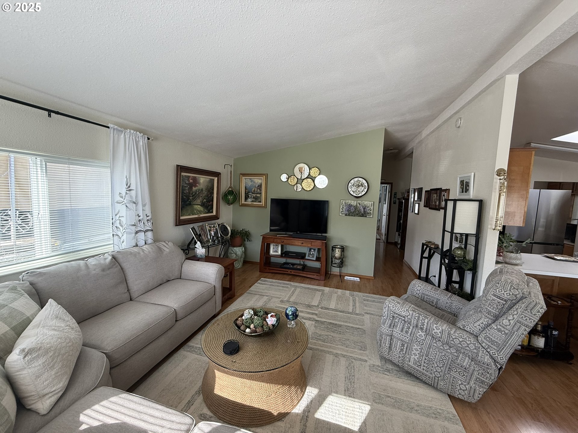 100 River Bend Road, Unit 17 Reedsport, OR 97467 - Photo 5 of 29 a living room with furniture and a fireplace