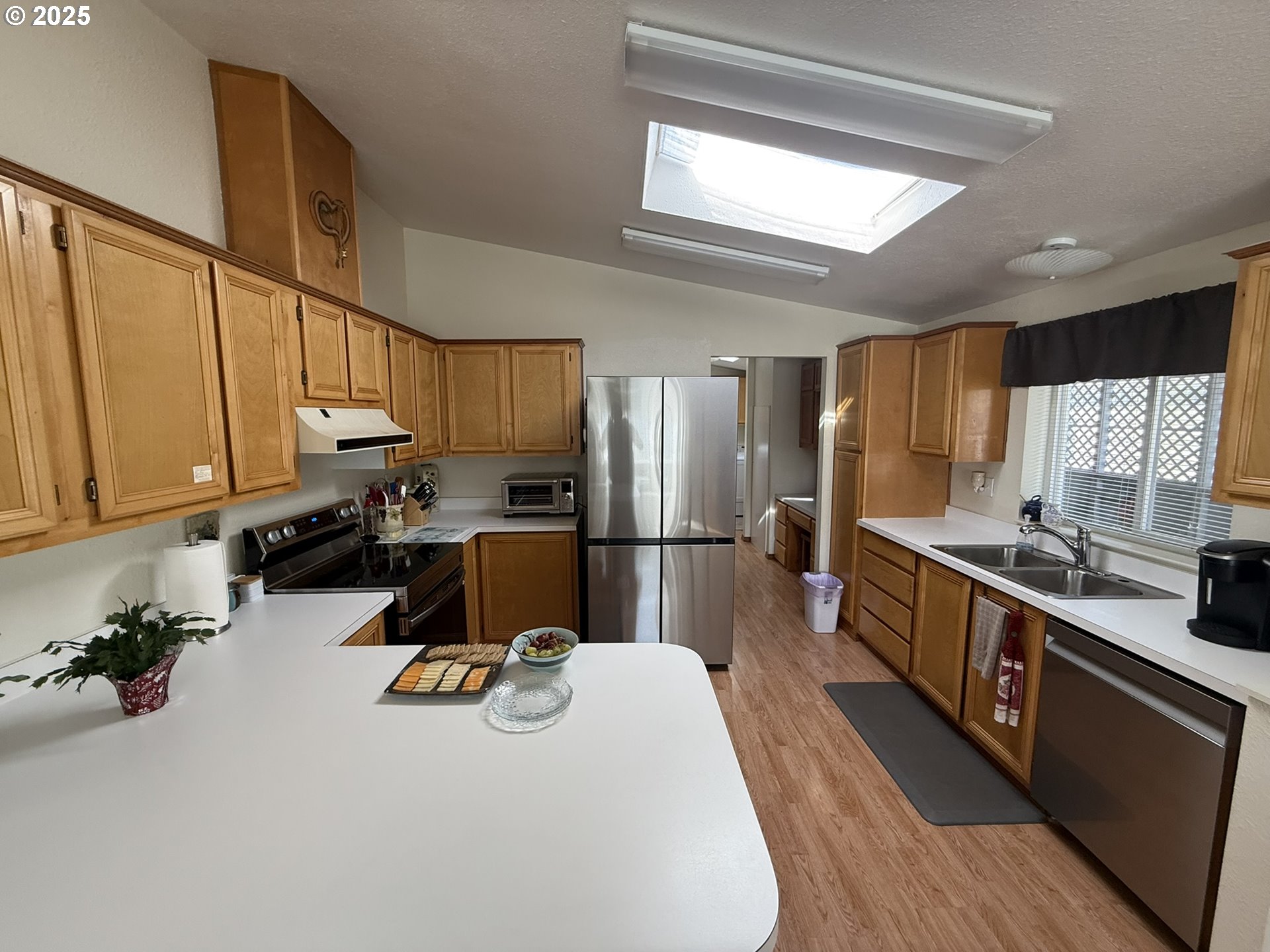 100 River Bend Road, Unit 17 Reedsport, OR 97467 - Photo 10 of 29 a kitchen with a sink appliances and cabinets