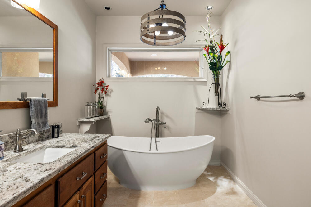11629 Merganser Road Klamath Falls, OR 97601 - Photo 41 of 50 a bathroom with a granite countertop sink and a mirror