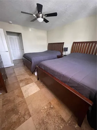 a bedroom with bed and window