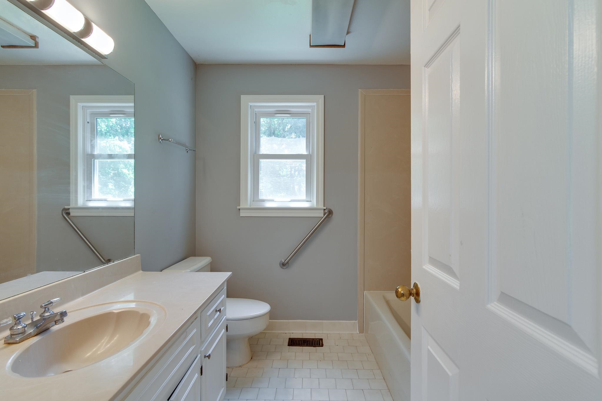 462 Woodbridge Road Somerville, TN 38068 - Photo 17 of 30 Full bathroom featuring tile patterned flooring, healthy amount of natural light, and vanity