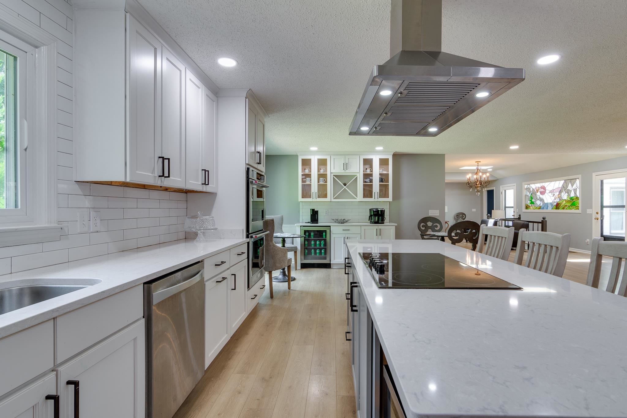 462 Woodbridge Road Somerville, TN 38068 - Photo 22 of 30 Kitchen featuring stainless steel appliances, exhaust hood, beverage cooler, light wood-style floors, and recessed lighting