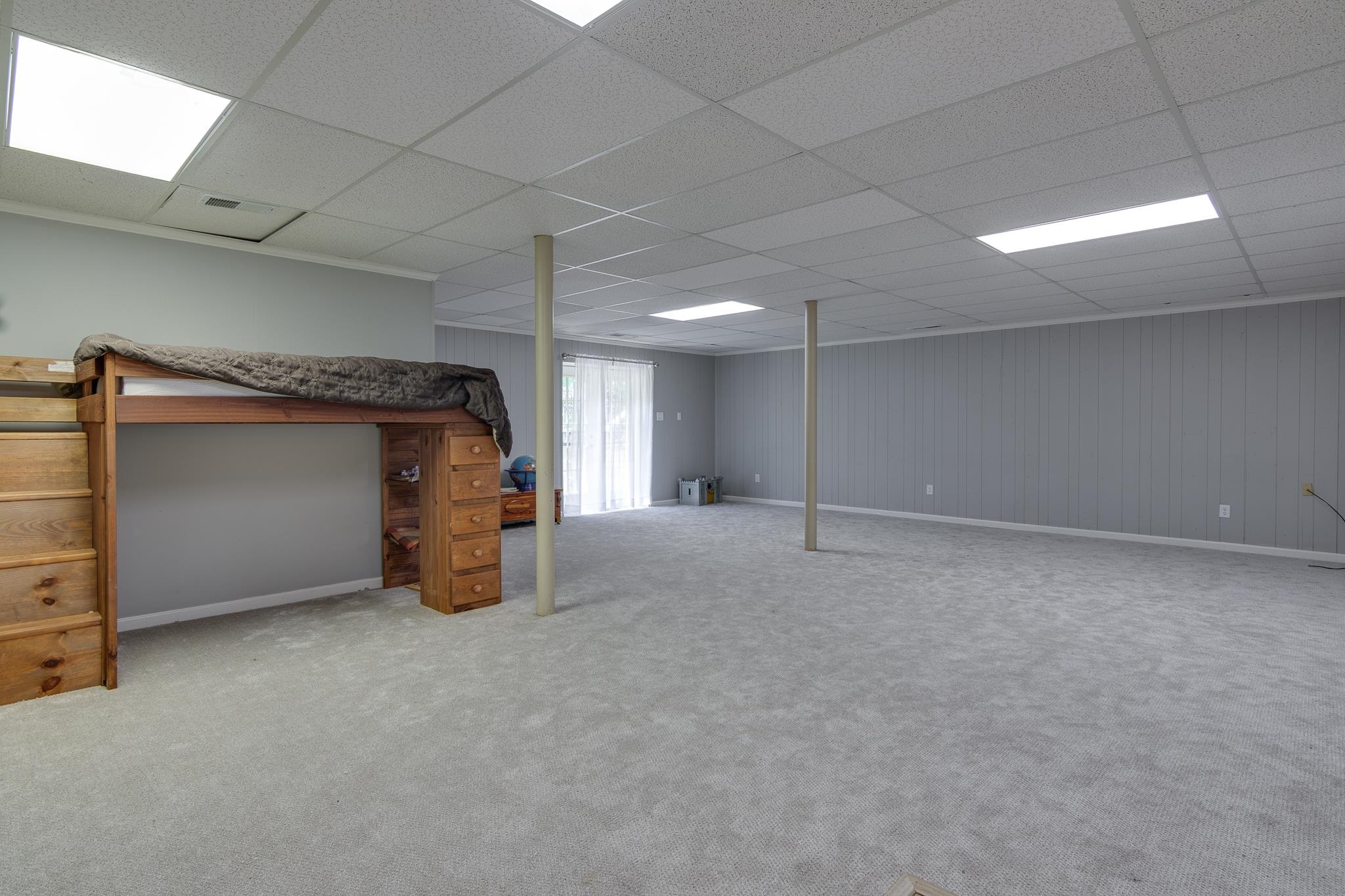 462 Woodbridge Road Somerville, TN 38068 - Photo 25 of 30 Below grade area with a drop ceiling and carpet flooring