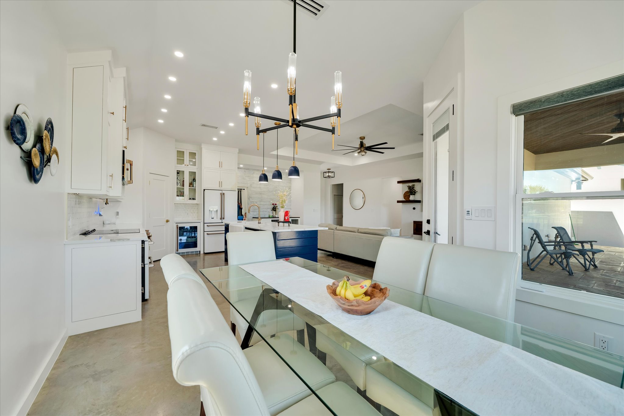 1611 Johnson Street Marble Falls, TX 78654 - Photo 13 of 40 a living room with kitchen island furniture and a chandelier