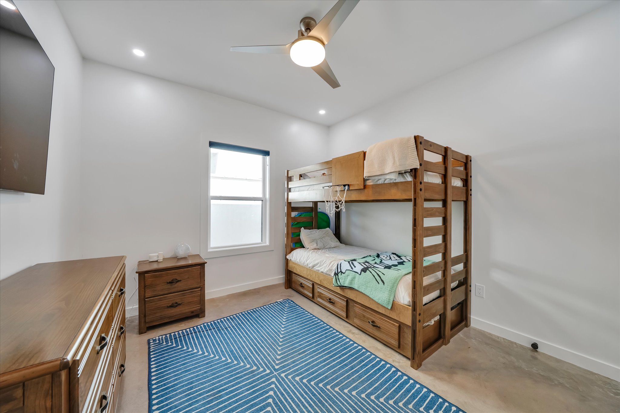 1611 Johnson Street Marble Falls, TX 78654 - Photo 17 of 40 a bedroom with furniture and a window