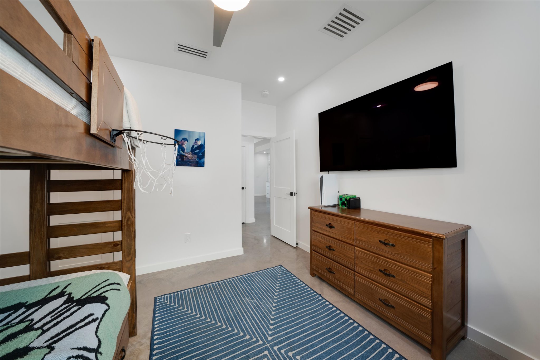 1611 Johnson Street Marble Falls, TX 78654 - Photo 18 of 40 a living room with furniture and a flat screen tv