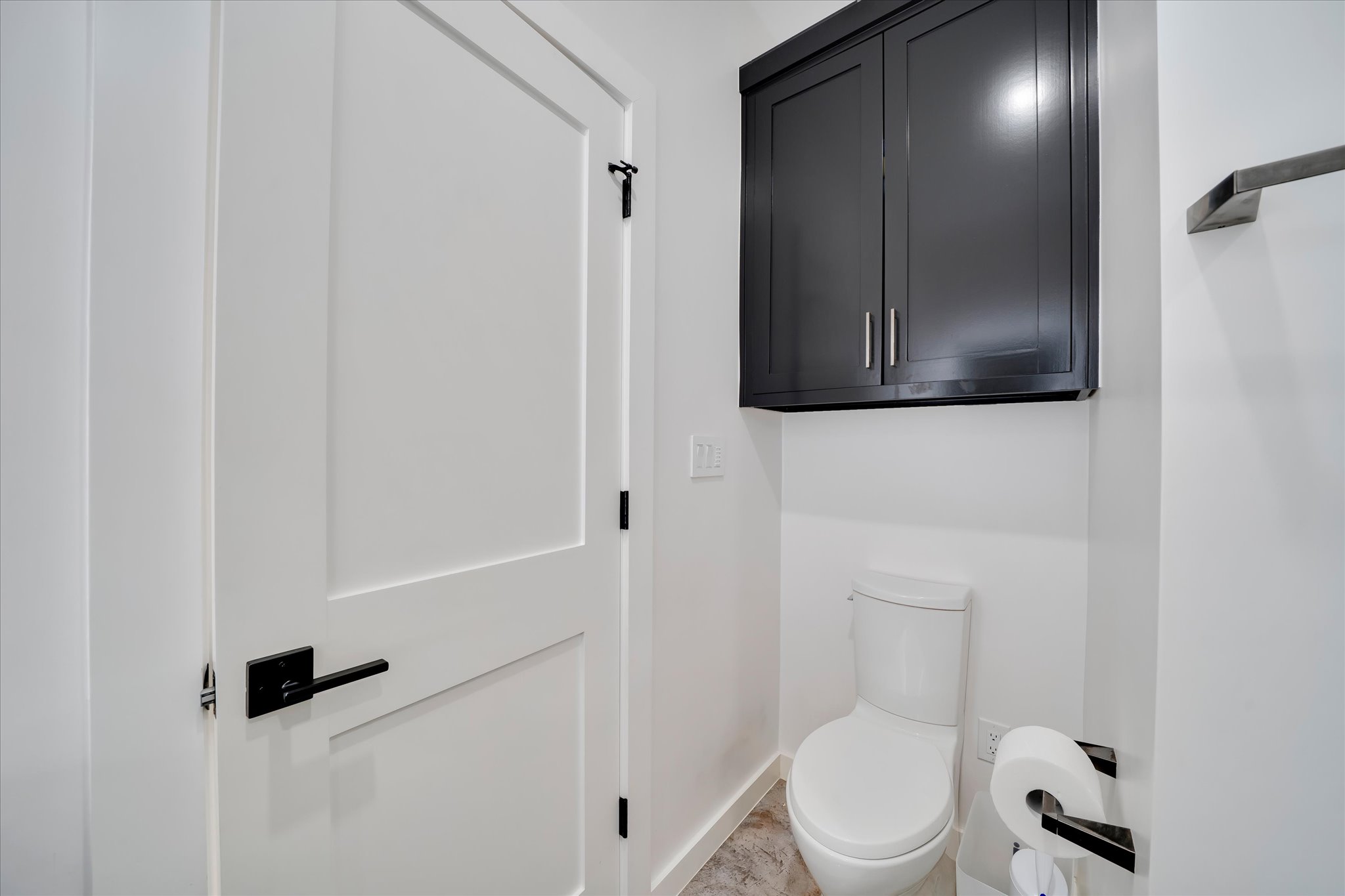 1611 Johnson Street Marble Falls, TX 78654 - Photo 20 of 40 a white toilet sitting next to a bathroom sink