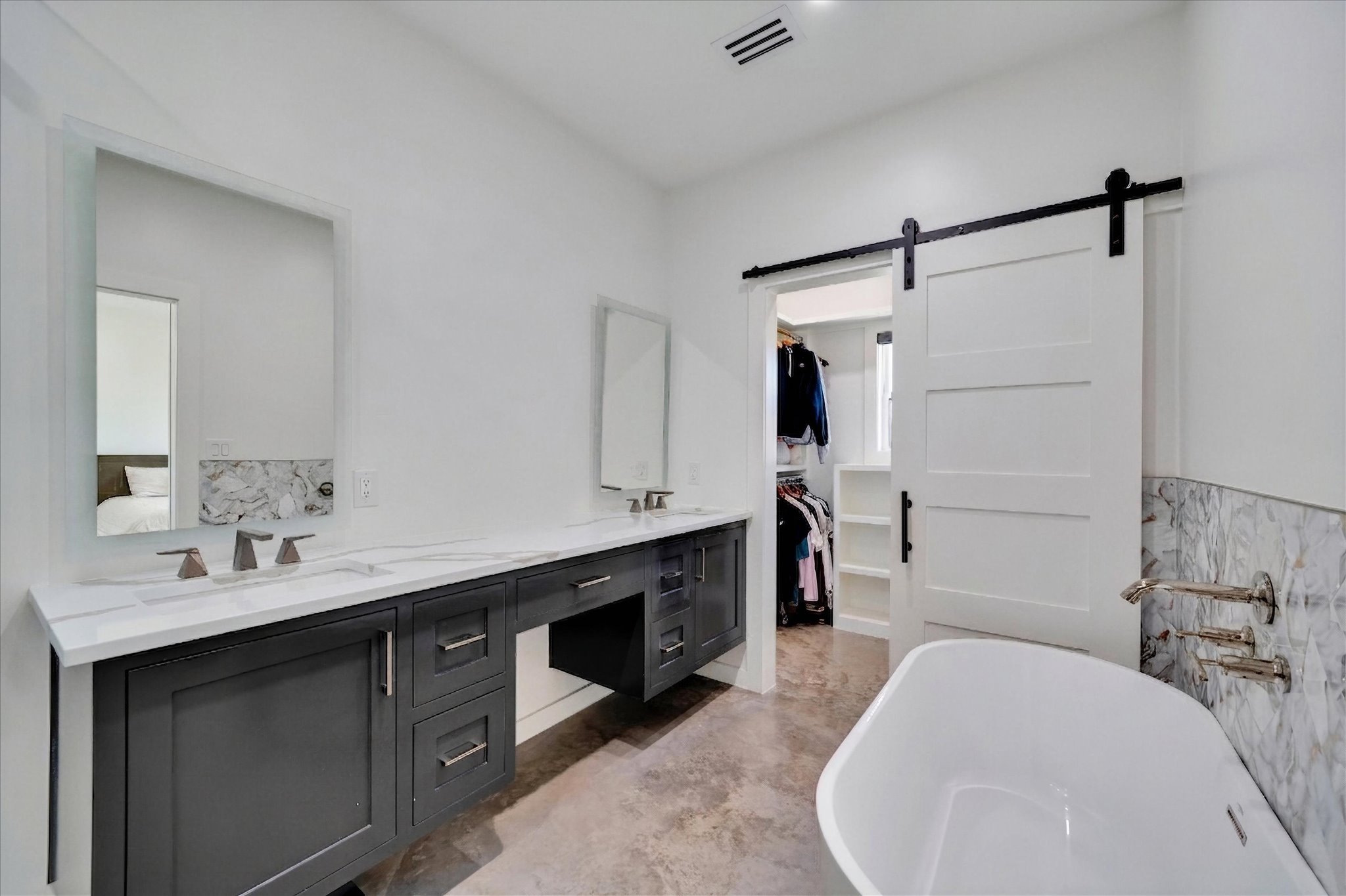 1611 Johnson Street Marble Falls, TX 78654 - Photo 24 of 40 a en suite bathroom with a double vanity sink and a mirror