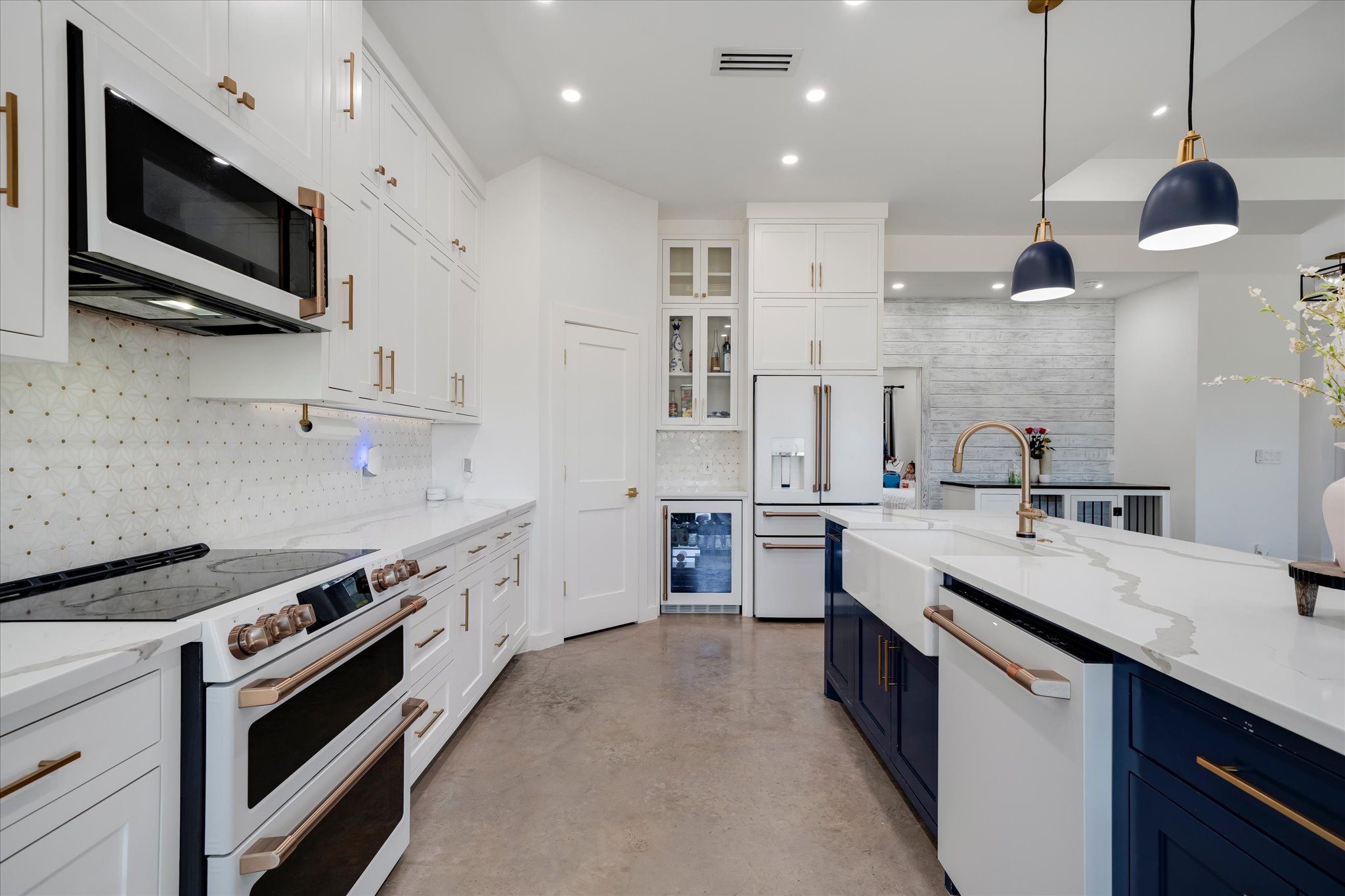 1611 Johnson Street Marble Falls, TX 78654 - Photo 8 of 40 a kitchen with stainless steel appliances a stove sink microwave and cabinets