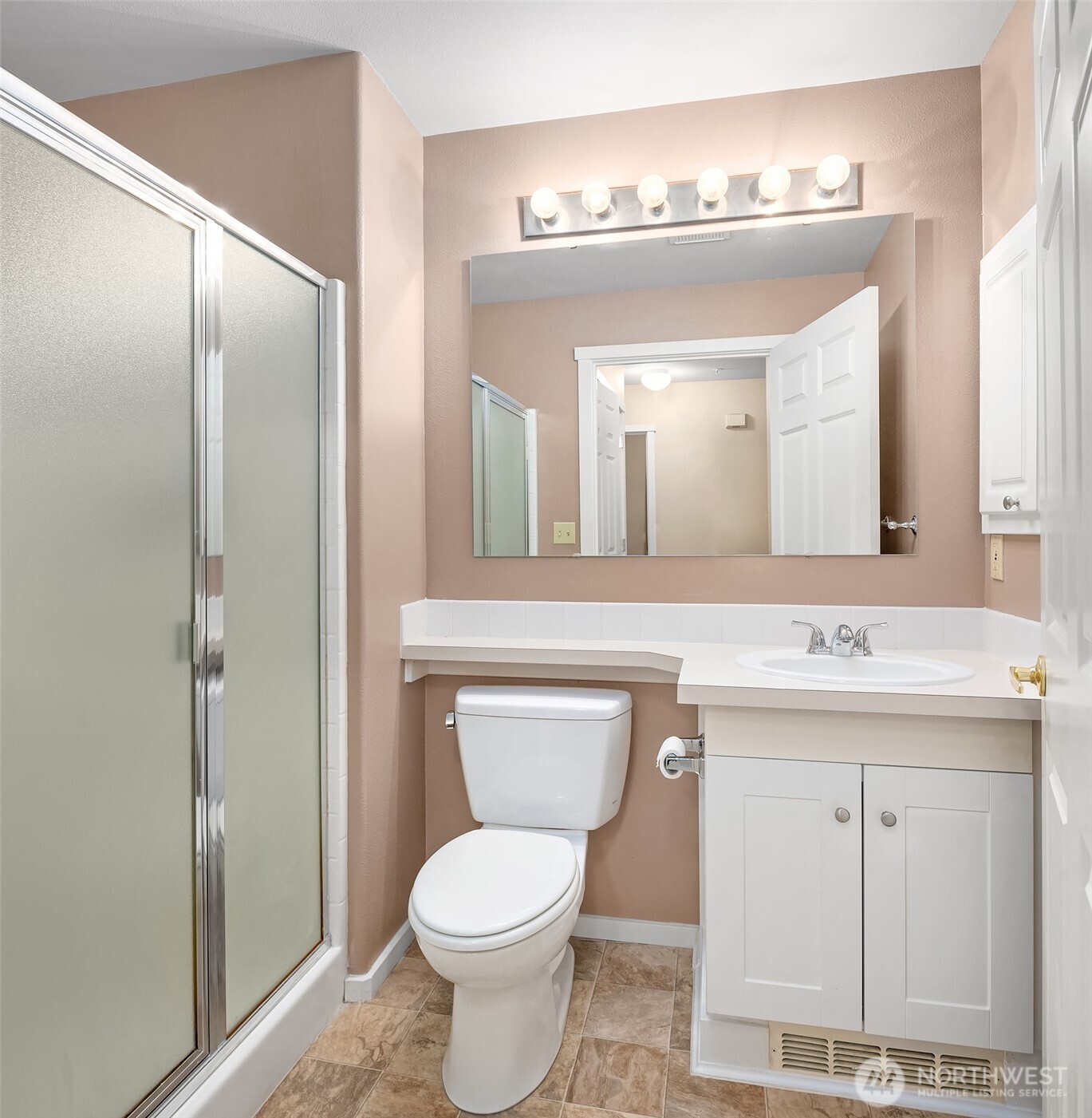 4325 Northeast 5th Court, Unit C101 Renton, WA 98059 - Photo 15 of 17 a bathroom with a toilet sink and mirror