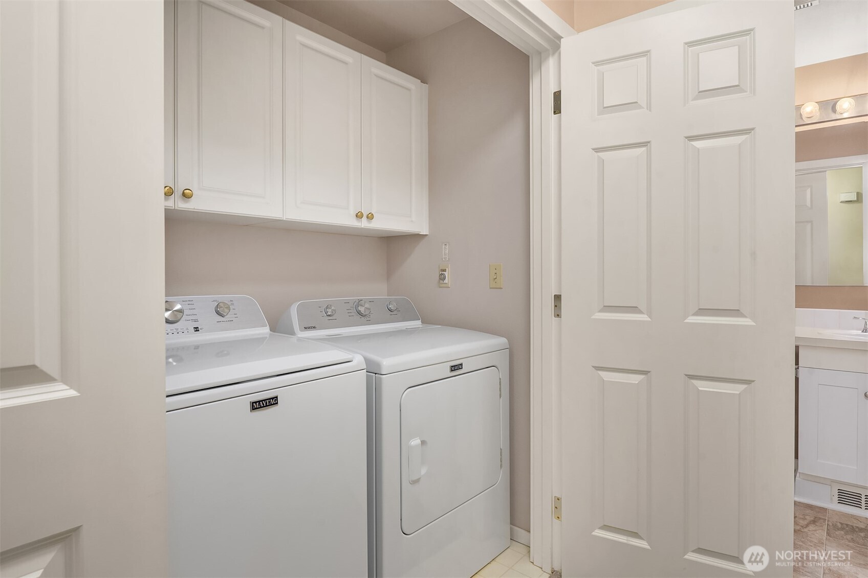 4325 Northeast 5th Court, Unit C101 Renton, WA 98059 - Photo 16 of 17 a utility room with dryer and washer