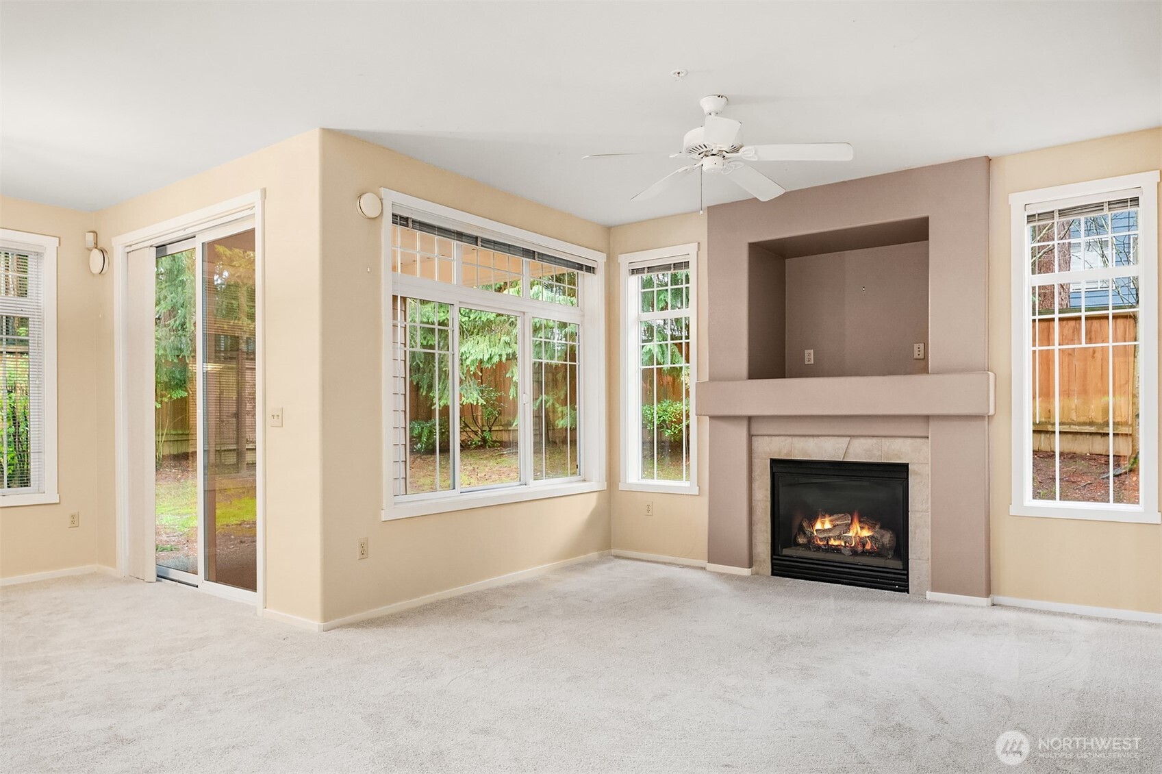 4325 Northeast 5th Court, Unit C101 Renton, WA 98059 - Photo 3 of 17 a view of an empty room with fireplace and a window