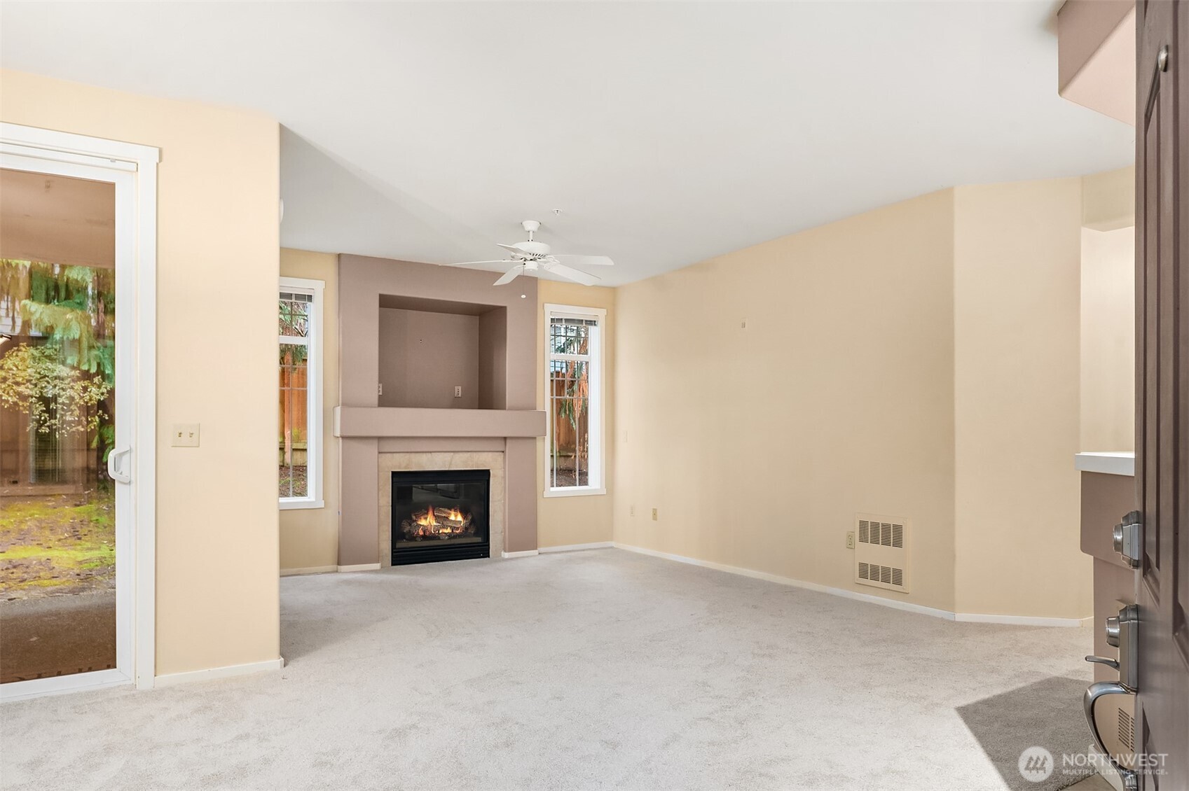 4325 Northeast 5th Court, Unit C101 Renton, WA 98059 - Photo 4 of 17 a view of a livingroom with furniture and a fireplace