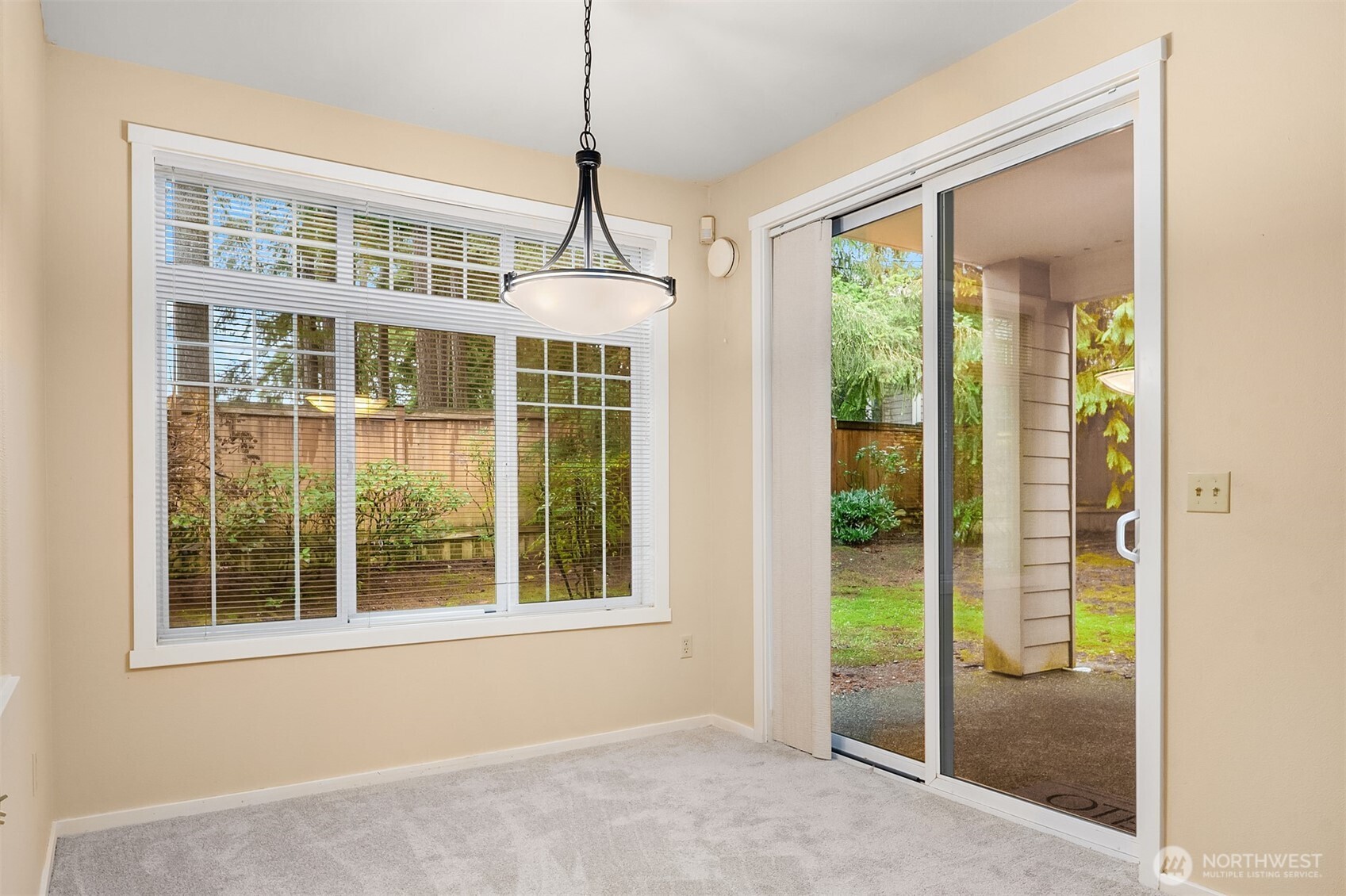 4325 Northeast 5th Court, Unit C101 Renton, WA 98059 - Photo 10 of 17 a view of empty room with windows