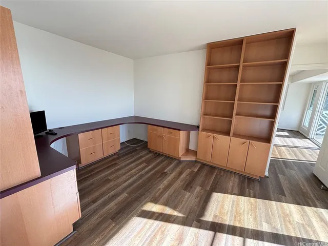 a kitchen with stainless steel appliances a sink a stove top oven a counter space and cabinets