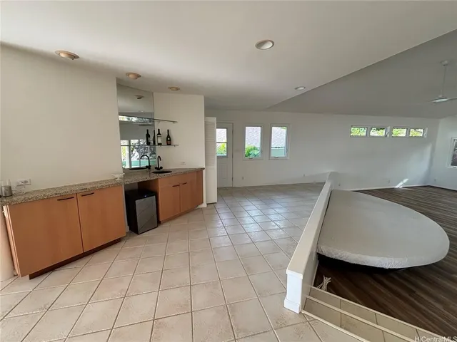 a kitchen with a sink stove top oven and cabinets