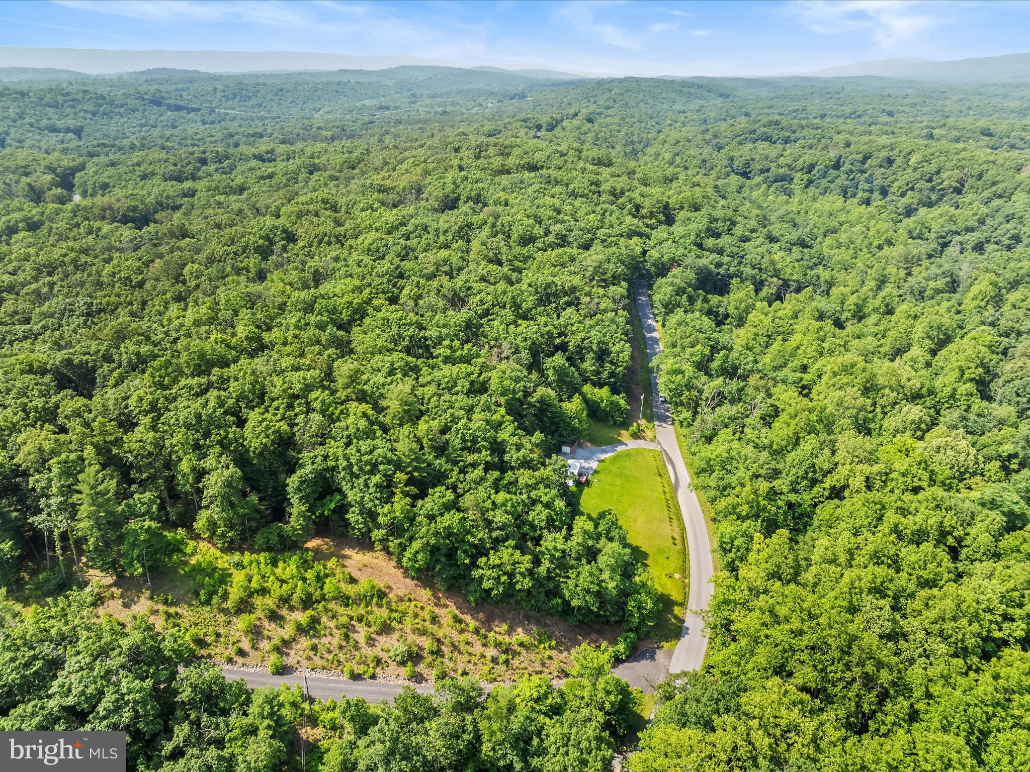 2732 Crossroad School Road Hedgesville, WV 25427 - Photo 17 of 41 a view of a yard with a house